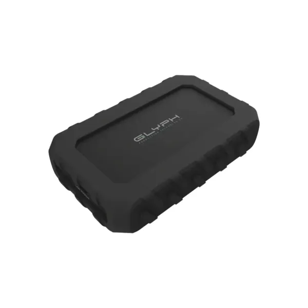 Vue en perspective du SSD portable Glyph Atom EX40 posé à plat, mettant en évidence le logo de la marque et son châssis renforcé conçu pour les flux de production intensifs.